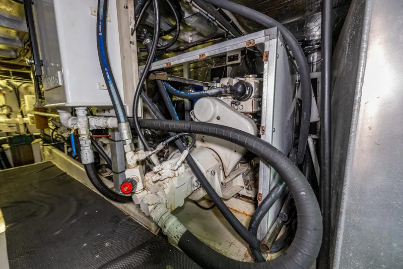 Kell Bell Yacht Photos Pics Engine room of 2001 Navigator Pilothouse yacht with visible machinery and hoses.