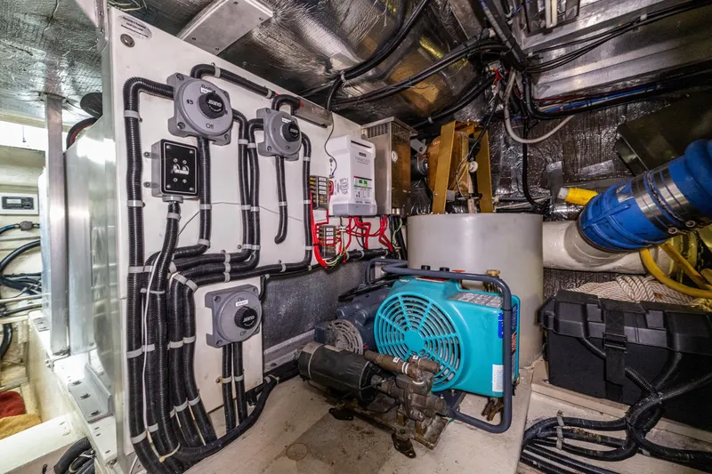 Kell Bell Yacht Photos Pics Engine room of 2001 Navigator Pilothouse yacht with electrical systems and machinery.