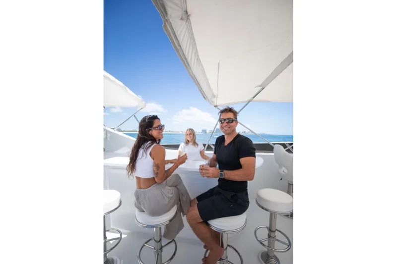 Carpe Diem Yacht Photos Pics People enjoying a sunny day on a 2001 Intermarine RPH 95 yacht.