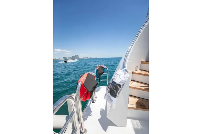 Carpe Diem Yacht Photos Pics Intermarine RPH 95 yacht deck with ocean view, life jackets, and stairs, 2001 model.