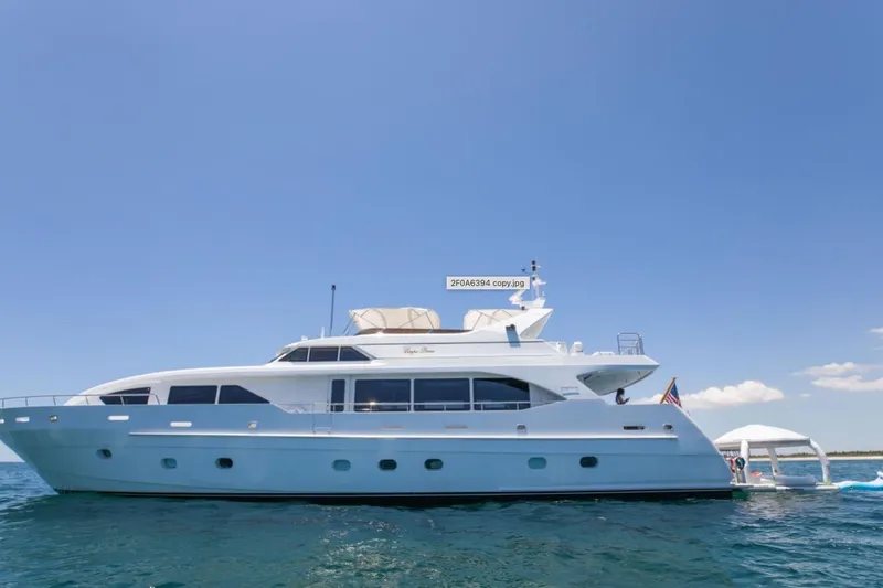 Carpe Diem Yacht Photos Pics Luxury 2001 Intermarine RPH 95 yacht on open water under clear blue sky.