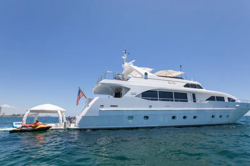 Carpe Diem Yacht Photos Pics Luxury yacht Intermarine RPH 95, 2001 model, anchored with jet ski and inflatable dock.