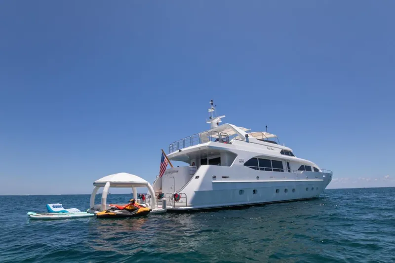 Carpe Diem Yacht Photos Pics Luxury yacht Intermarine RPH 95, 2001 model, anchored with water toys in the ocean.