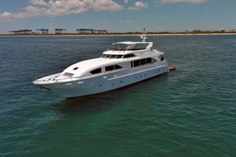 Carpe Diem Yacht Photos Pics Luxury yacht Intermarine RPH 95, 2001 model, anchored in calm waters under a clear sky.