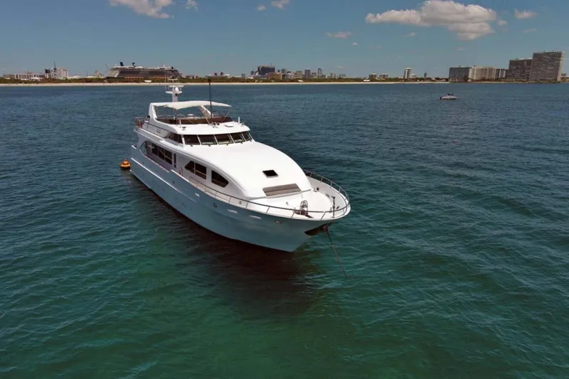 Carpe Diem Yacht Photos Pics Luxury yacht Intermarine RPH 95, 2001 model, anchored in clear blue waters.