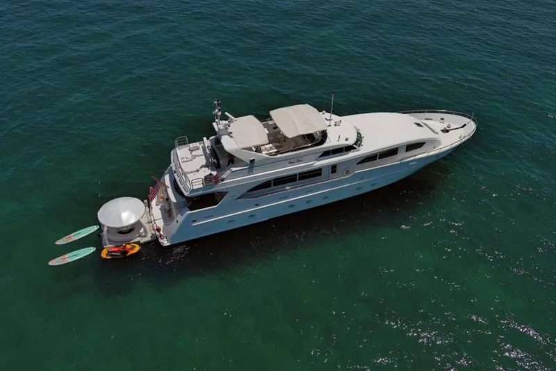 Carpe Diem Yacht Photos Pics Aerial view of 2001 Intermarine RPH 95 yacht with paddleboards and kayak.