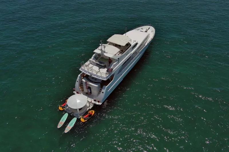 Carpe Diem Yacht Photos Pics Aerial view of 2001 Intermarine RPH 95 yacht with paddleboards and kayaks.