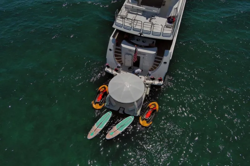Carpe Diem Yacht Photos Pics Aerial view of 2001 Intermarine RPH 95 yacht with kayaks and paddleboards.