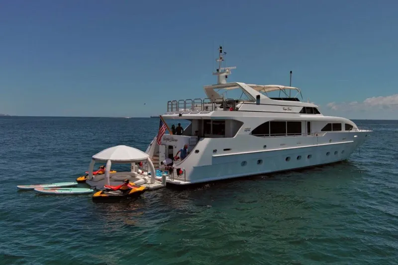 Carpe Diem Yacht Photos Pics Luxury 2001 Intermarine RPH 95 yacht with water sports equipment on ocean.