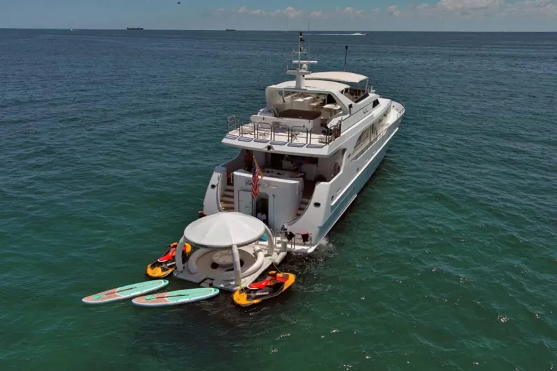 Carpe Diem Yacht Photos Pics Luxury yacht Intermarine RPH 95 (2001) with water sports equipment in open sea.