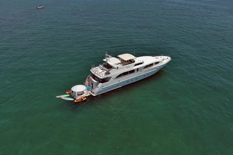 Carpe Diem Yacht Photos Pics Luxury yacht Intermarine RPH 95 (2001) anchored in clear ocean waters.