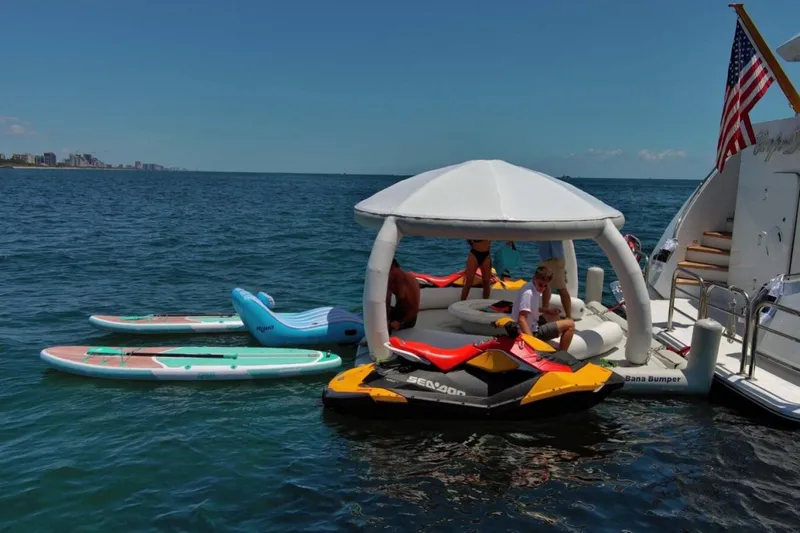 Carpe Diem Yacht Photos Pics Luxury yacht Intermarine RPH 95 with paddleboards and jet ski on the ocean, 2001 model.