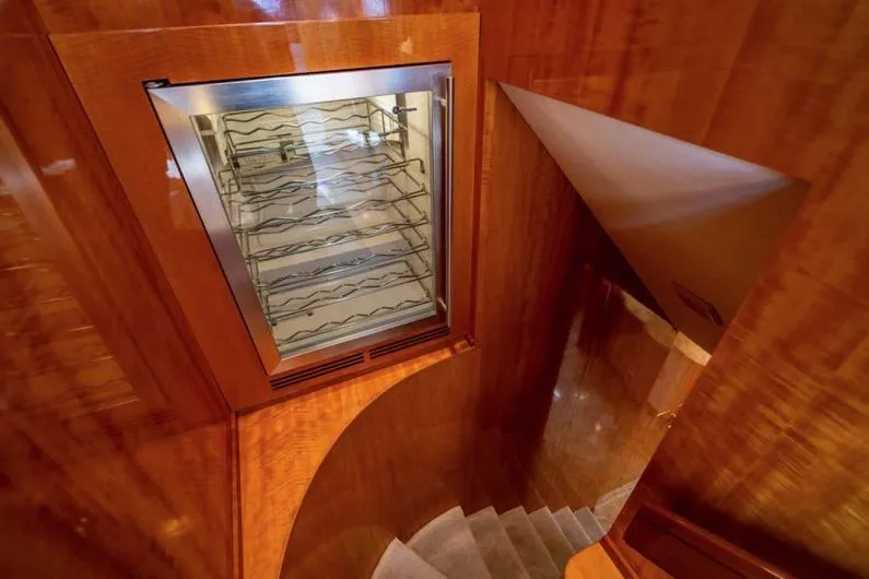Carpe Diem Yacht Photos Pics Luxurious wooden yacht interior with a built-in wine cooler, Intermarine RPH 95, 2001 model.