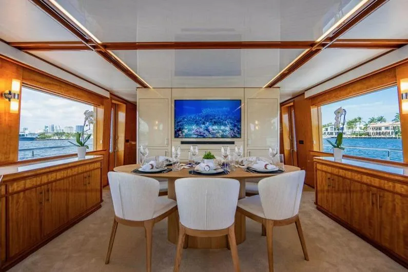 Carpe Diem Yacht Photos Pics Luxurious dining area on 2001 Intermarine RPH 95 yacht with elegant decor and waterfront views.