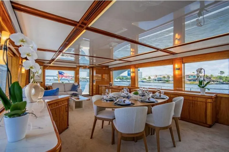 Carpe Diem Yacht Photos Pics Luxurious 2001 Intermarine RPH 95 yacht interior with elegant dining area and scenic views.