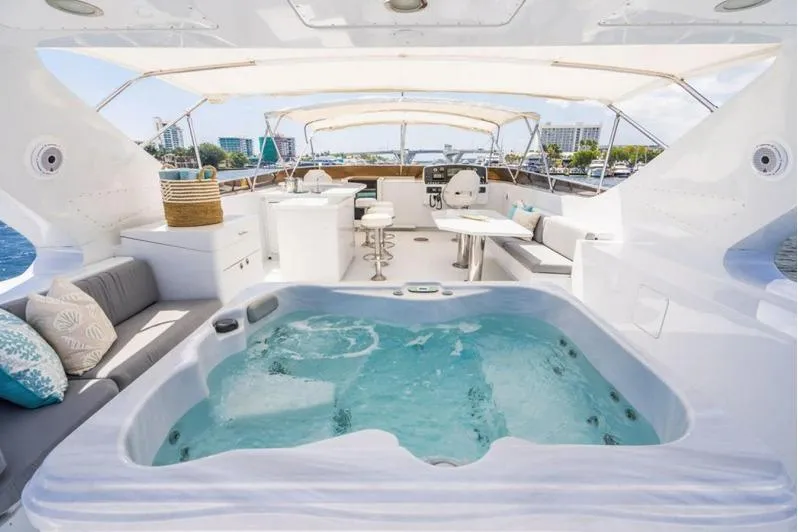 Carpe Diem Yacht Photos Pics Luxurious 2001 Intermarine RPH 95 yacht with jacuzzi and elegant seating area.