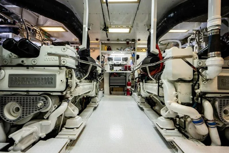 Carpe Diem Yacht Photos Pics Engine room of a 2001 Intermarine RPH 95 yacht, showcasing powerful marine engines.
