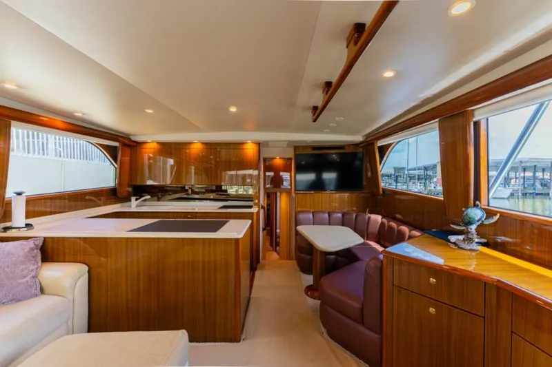 Kraken Yacht Photos Pics Luxurious interior of a 2007 Viking 52 Convertible yacht with elegant wood finishes.