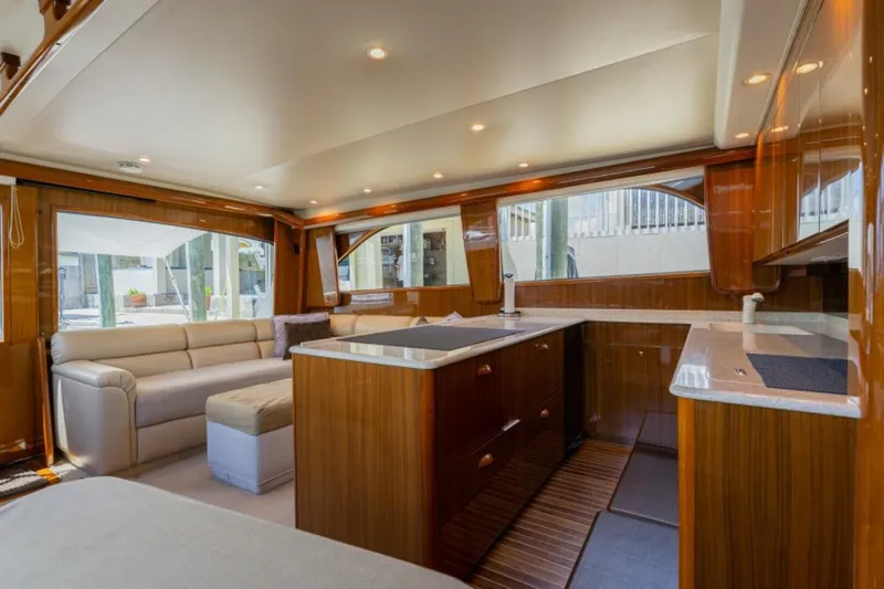 Kraken Yacht Photos Pics Luxurious interior of a 2007 Viking 52 Convertible yacht with elegant wood finishes.