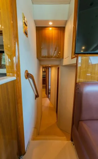 Kraken Yacht Photos Pics Interior hallway of 2007 Viking 52 Convertible yacht with wooden finishes.