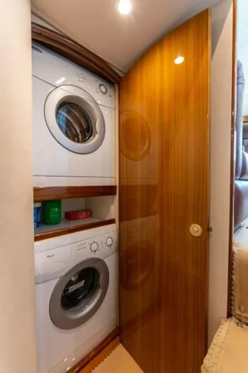 Kraken Yacht Photos Pics Stacked washer and dryer in 2007 Viking 52 Convertible yacht interior.