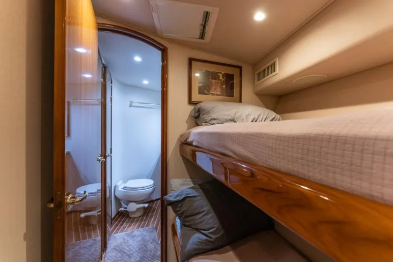 Kraken Yacht Photos Pics Interior of 2007 Viking 52 Convertible yacht with bunk beds and bathroom.