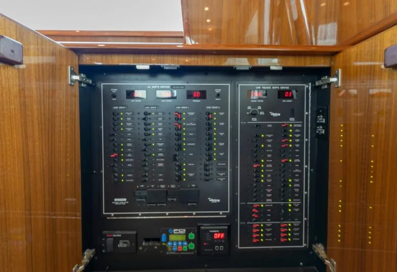 Kraken Yacht Photos Pics Electrical panel inside a 2007 Viking 52 Convertible yacht, showcasing circuit breakers and controls.