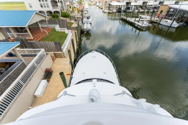Kraken Yacht Photos Pics Aerial view of 2007 Viking 52 Convertible yacht docked in a residential marina.