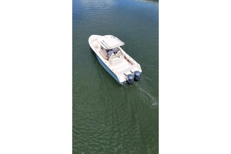  Yacht Photos Pics 2019 Grady-White Canyon 306 boat on calm water, aerial view.