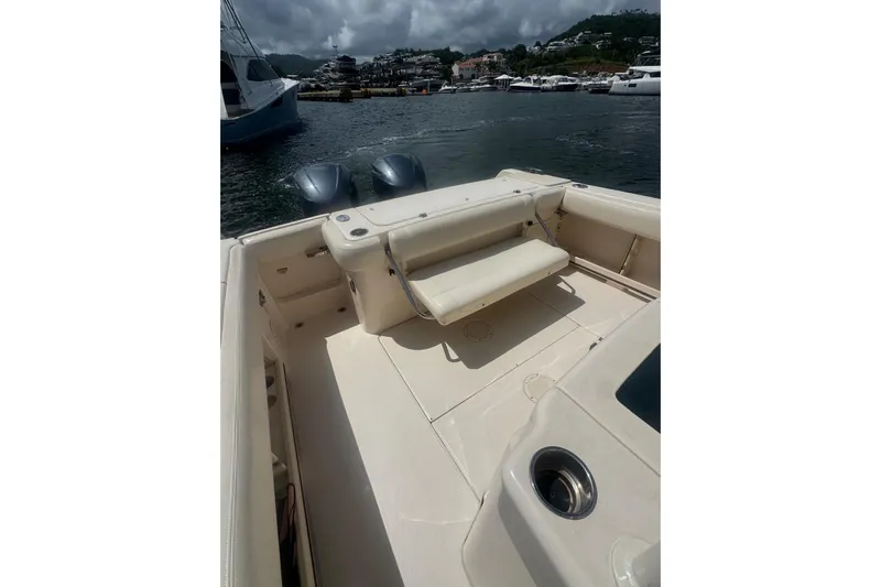  Yacht Photos Pics 2019 Grady-White Canyon 306 boat interior with seating, docked in a marina.