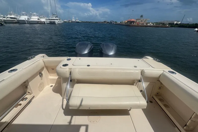  Yacht Photos Pics 2019 Grady-White Canyon 306 boat interior with seating, docked in a marina.