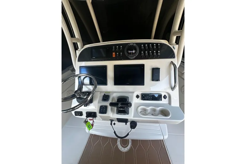  Yacht Photos Pics 2019 Grady-White Canyon 306 helm with steering wheel, controls, and electronic displays.