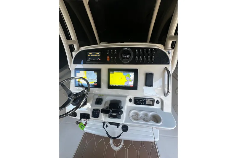  Yacht Photos Pics 2019 Grady-White Canyon 306 helm with navigation screens and controls.