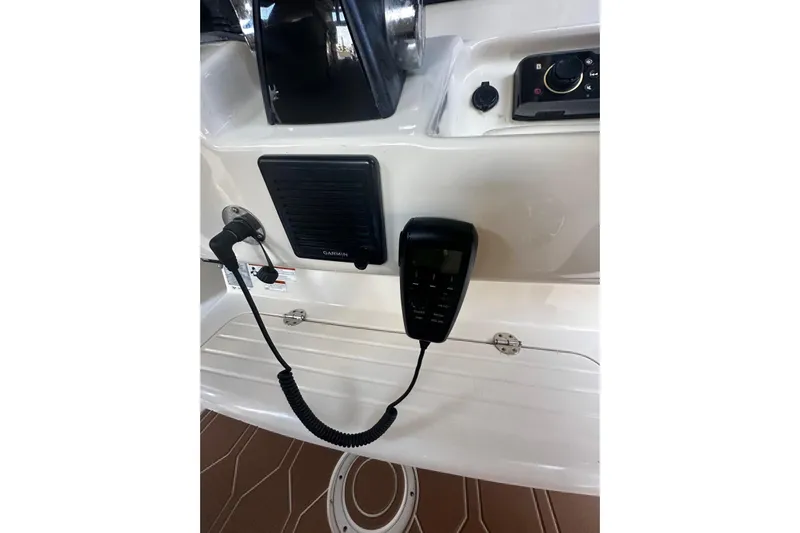  Yacht Photos Pics Control panel of 2019 Grady-White Canyon 306 boat with Garmin speaker and microphone.