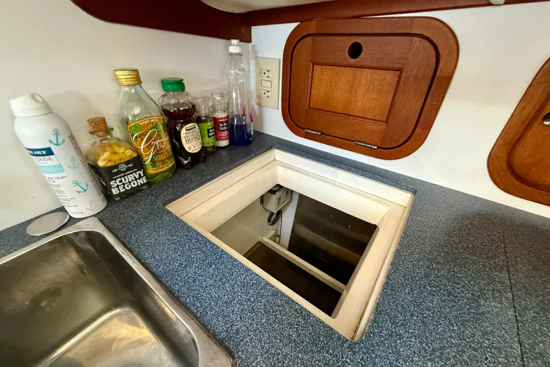 St. Elmo's Fire II Yacht Photos Pics Kitchen area of a 1999 Legacy 40 boat with countertop and storage.