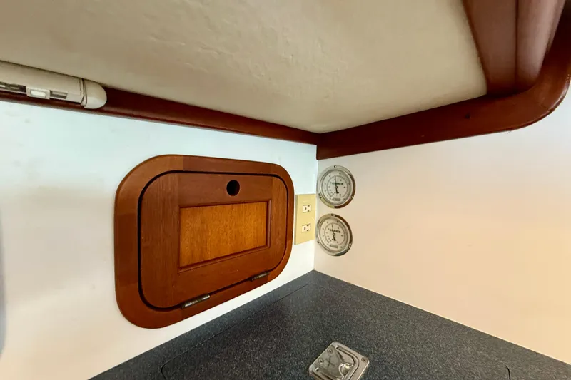 St. Elmo's Fire II Yacht Photos Pics Interior of 1999 Legacy 40 boat with wooden panel and gauges.