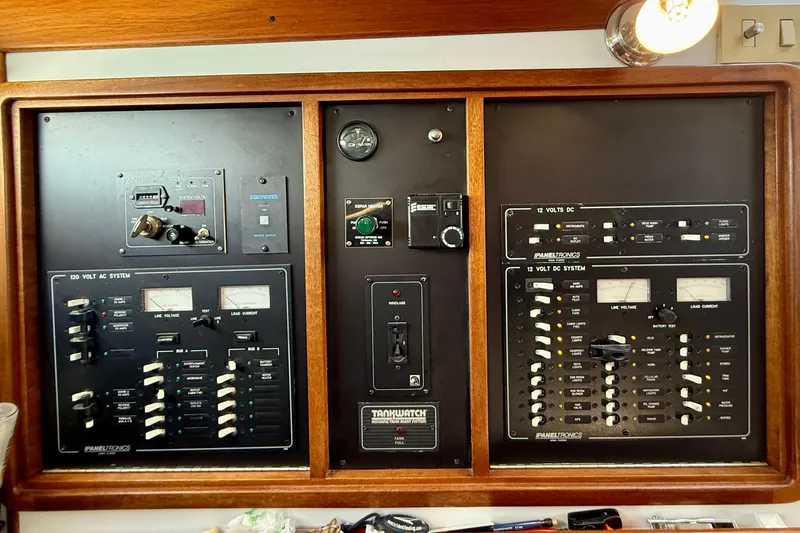 St. Elmo's Fire II Yacht Photos Pics Electrical control panel on a 1999 Legacy 40 boat, featuring AC and DC systems.