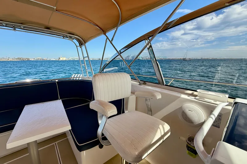 St. Elmo's Fire II Yacht Photos Pics 1999 Legacy 40 yacht interior with seating, table, and ocean view.