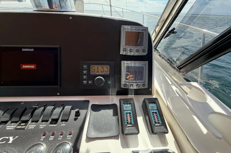 St. Elmo's Fire II Yacht Photos Pics Control panel of a 1999 Legacy 40 boat with Simrad navigation system.
