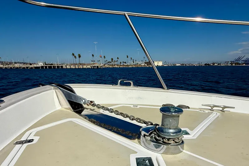 St. Elmo's Fire II Yacht Photos Pics Bow of 1999 Legacy 40 boat with anchor chain, ocean view, and clear blue sky.