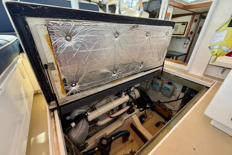 St. Elmo's Fire II Yacht Photos Pics Engine compartment of a 1999 Legacy 40 boat, showcasing insulation and mechanical components.