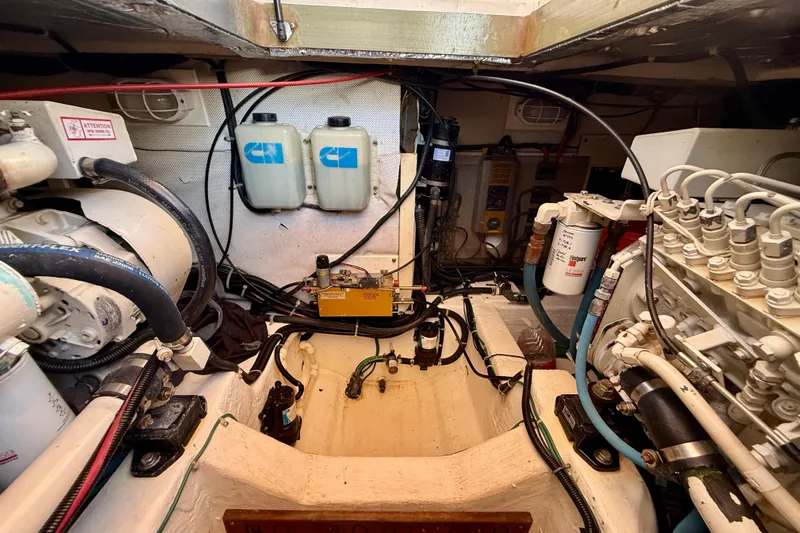 St. Elmo's Fire II Yacht Photos Pics Engine room of a 1999 Legacy 40 boat, showcasing mechanical components and wiring.