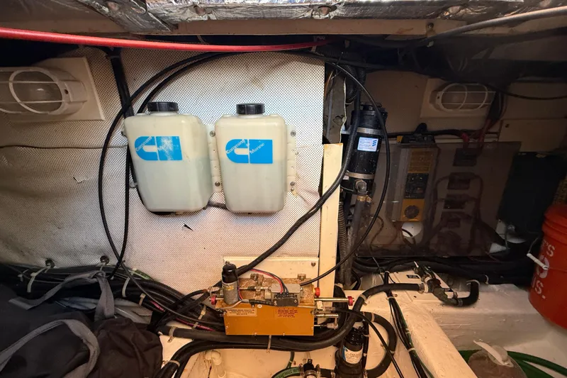 St. Elmo's Fire II Yacht Photos Pics Engine room of 1999 Legacy 40 boat with dual fluid tanks and wiring.