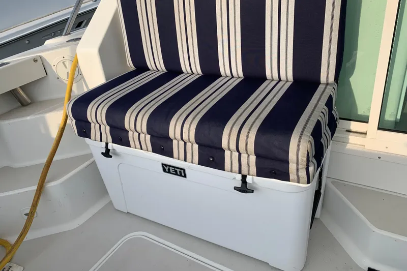 Tranquility Yacht Photos Pics Striped cushioned seat on Yeti cooler aboard 2008 Back Cove 33 Hard Top Express.