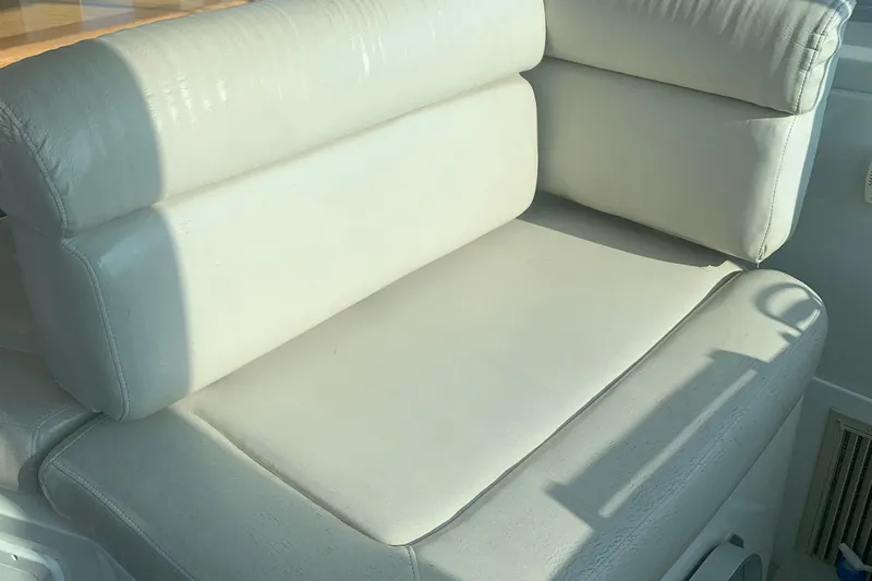 Tranquility Yacht Photos Pics White leather seating on a 2008 Back Cove 33 Hard Top Express boat.