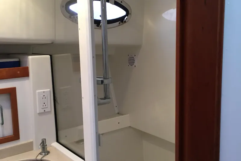 Tranquility Yacht Photos Pics 2008 Back Cove 33 Hard Top Express bathroom with sink and shower.
