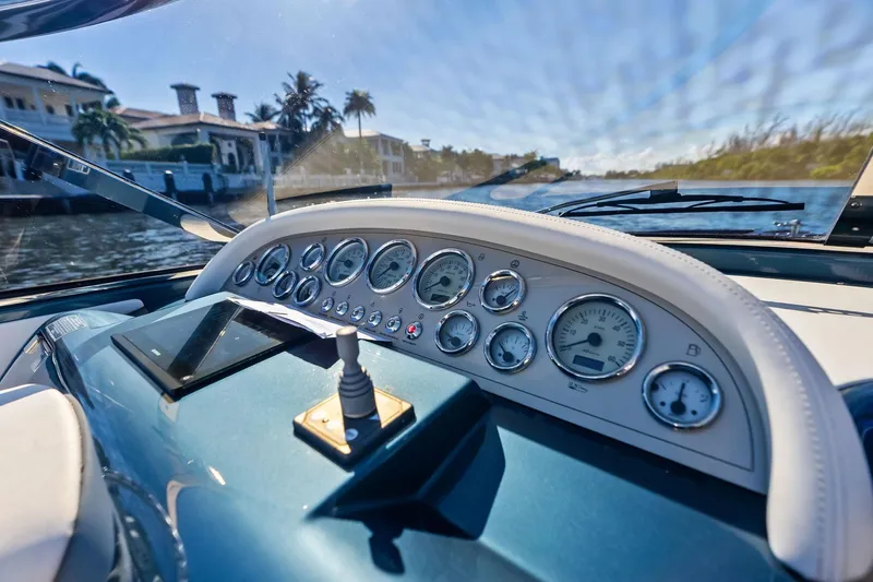 Isola Yacht Photos Pics Dashboard of a 2013 Riva 33 Aquariva boat with gauges and controls.