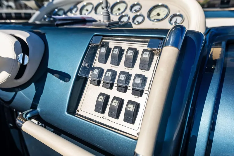 Isola Yacht Photos Pics Control panel of a 2013 Riva 33 Aquariva boat with switches and gauges.