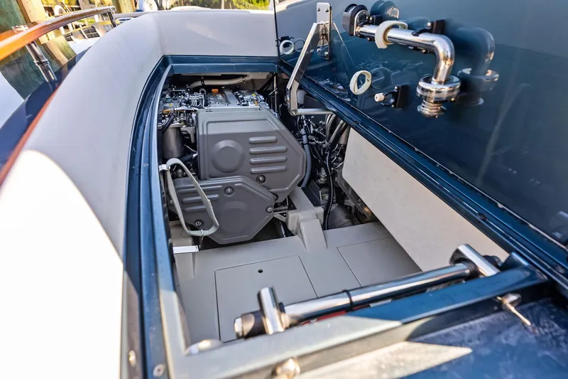 Isola Yacht Photos Pics Engine compartment of 2013 Riva 33 Aquariva boat, showcasing mechanical components and sleek design.