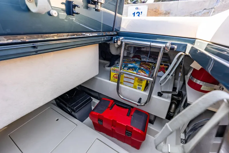 Isola Yacht Photos Pics Storage compartment of 2013 Riva 33 Aquariva boat with tools and supplies.